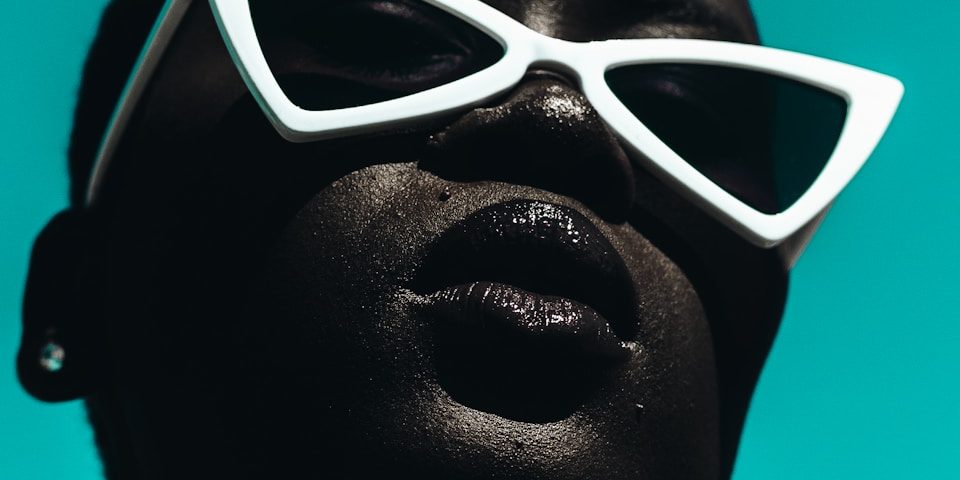 woman wearing white framed edgy sunglasses