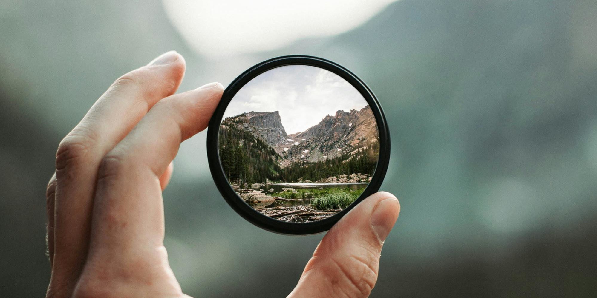 pexels-photo-2853432-2853432 A stunning mountain landscape magnified through a handheld lens highlighting exploration and adventure.